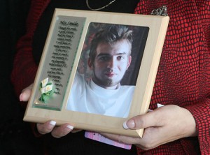 Dorothea Carroll holds a picture of her son, Andrew Hanlon, who was fatally shot by a police officer in Silverton, Oregon in 2008. Hanlon was showing signs of paranoia and possible schizophrenia when he was shot.
